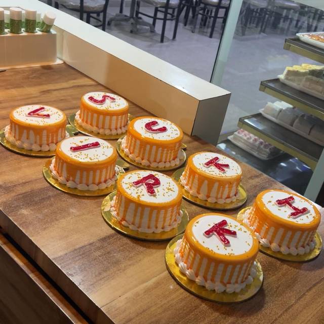 Letter cakes lined up on the bakery counter